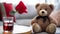 A close-up photograph where a lovable brown teddy bear takes center stage against a romantically blurred living room setting.