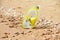 Close up photography of yellow snorkling mask standing in the sand.Underwater diving concept