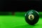 Close-up photos of billiard ball, number 6 and green floor