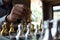 Close-up photos of checkmate hands on a chessboard during a chess game The concept of business victory strategy wins the intellige