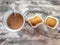 Close-up photos of espresso hot coffee and bread baked on a wooden background. Top view