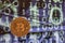 Close up physical bitcoin coin with dollars and matrix codes background