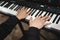 close-up of a pianist\'s hands while playing the piano