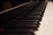 Close-up of piano keys. Black grand piano keyboard