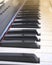 Close up piano keys on sunset light. Classic, jazz or electronical music concept.