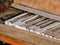 Close up of piano keys of an upright antique broken rustic piano outdoors in Arizona desert