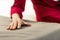 Close-up picture of aging lady hand lying on bed sheets