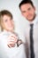 Close-up picture of cheerful young realtor couple holding house keys