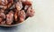 Close up picture of jumbo raisins in a bowl, selective focus