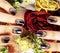 Close up picture of manicure nails with dry flower red rose, deh