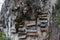 Close-up picture of a mountain-wall with some hanging coffins, Sagada, Luzon, Philippines