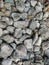 A close up picture of a pile of grey stones on the ground