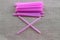 Close-up picture of pink plastic tube  on a sack cloth background  Concepts of using plastic tubes