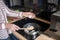 Close up picture of a woman stirring food on a frying pan