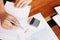 Close-up pictures of the hands of businessmen signing and stamping in approved contract forms