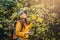 Close-up pictures of happy young women relaxing enjoying beauty Bua Tong yellow flower