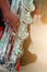 Close-up pictures of musicians playing  Baritone Saxophone  In the music practice room, blurred background.