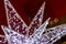 Close-up of piece of Christmas star decoration, blurred background with bokeh