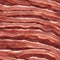 close up of a piece of meat A close-up of strips of bacon texture with a smooth and shiny surface
