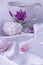 Close-up on a piece of oriental sweets, which lies on silk. Marshmallow and Sweets for tea. Behind them is a cup with floral