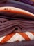 Close up of a pile of assorted ironed and folded clothes