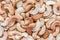 Close up pile of cashew nuts on wooden board background.
