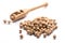 Close-up of pile of Chickpeas in a wooden spoon on white background