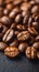 a close up of a pile of coffee beans on a table