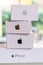 Close up of a pile of a collection of Apple iPhone boxes generations white boxes with Apple logo