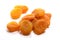 Close-up of pile dried, raw apricots on white background