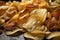 close-up of a pile of freshly fried potato chips, golden and crispy