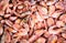 Close-up of a pile of frozen pink shrimps. Natural pink seafood background