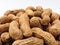 Close up  of a pile of raw peanuts also called groundnut isolated on white background. Food concept.