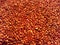 Close up of a pile of red quinoa seeds