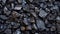 A close up of a pile of rocks that are black, AI