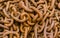 Close up, a pile of rusty old anchor chain links, background, te