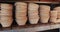 Close up of piles of pottery bowls on shelves in bakery kitchen, slow motion