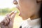 Close up of pill in the hand of a woman,sick asian child girl holding medicine,putting white tablet in mouth,tired female teen