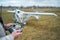 close up pilot hand with remote control joystick for agricultural spraying plane