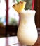 Close up of pina colada drink over blurred background created using generative ai technology