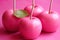 Close up of pink apples on pink background