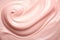 a close up of a pink cream