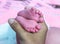 Close up pink feet of little baby in postpartum care unit with her mother, so cute.