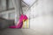 Close up pink high heel shoes woman legs filtered image