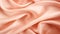 A close up of a pink silk fabric, peach fuzz, color of the year 2024, monochromatic image