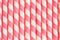 Close up of a Pink striped wafer stick rolls textured background