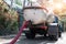 Close-up pipe hose of sewage truck car engine emptying home sewerage tank. Septic cleaning vacuum service and