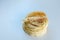 Close up of pita bread on white board.