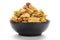 Close up of plane salty Golden Mixture Indian namkeen snacks on a ceramic black bowl