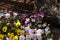 Close up of a planter filled with a wide variety of Pansy flowers on a patio table